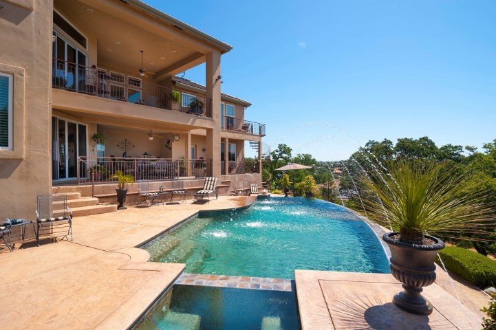 infinity pool infinity edge pool and spa, upper and lower balconies.