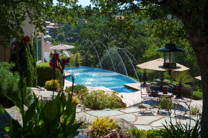 backyard beautiful backyard that includes built-in bbq, fireplace, pool & spa, multiple sitting areas, waterfall, custom landscaping and lighted pathways and a secure pet area.