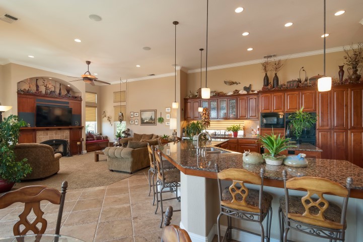 gourment kitchen & family room granite countertops, custom cabinetry, wine cooler, large prep areas, bar seating for 6, plus separate eating area. connected to open familiy room, perfect for entertaining.
