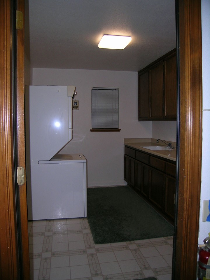laundry room big laundry room with sink and plenty of cabinet-storage space.